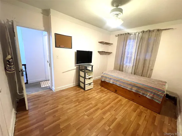 a bedroom with furniture and a window