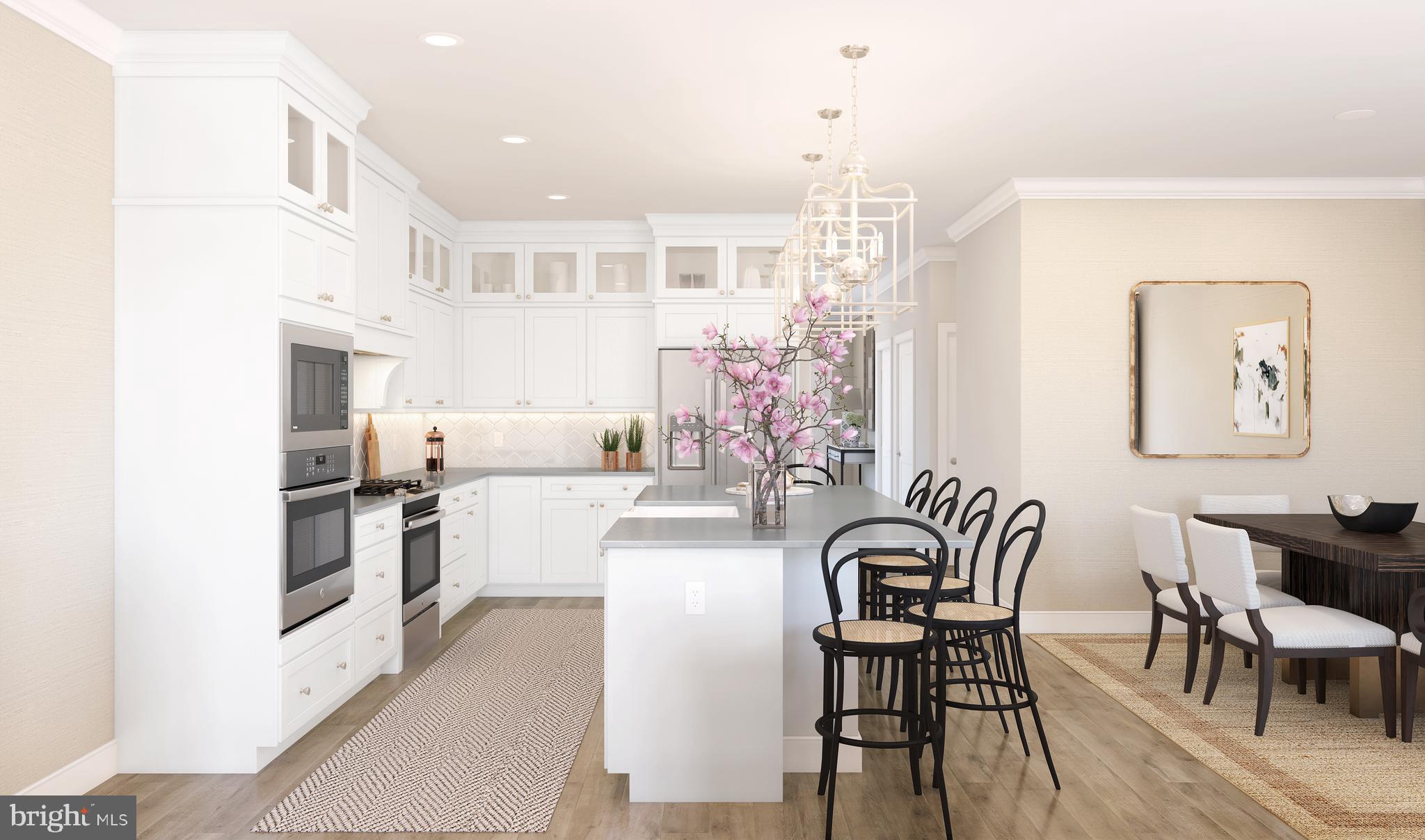 1402 Justin Drive, Unit 1403 West Windsor, NJ 08550 - Photo 6 of 15 a view of a dining room with furniture and wooden floor