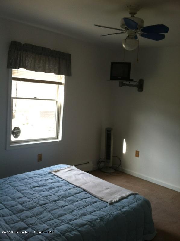 9021 State Rte 6 Meshoppen, PA 18630 - Photo 14 of 16 a bedroom with a bed and a window