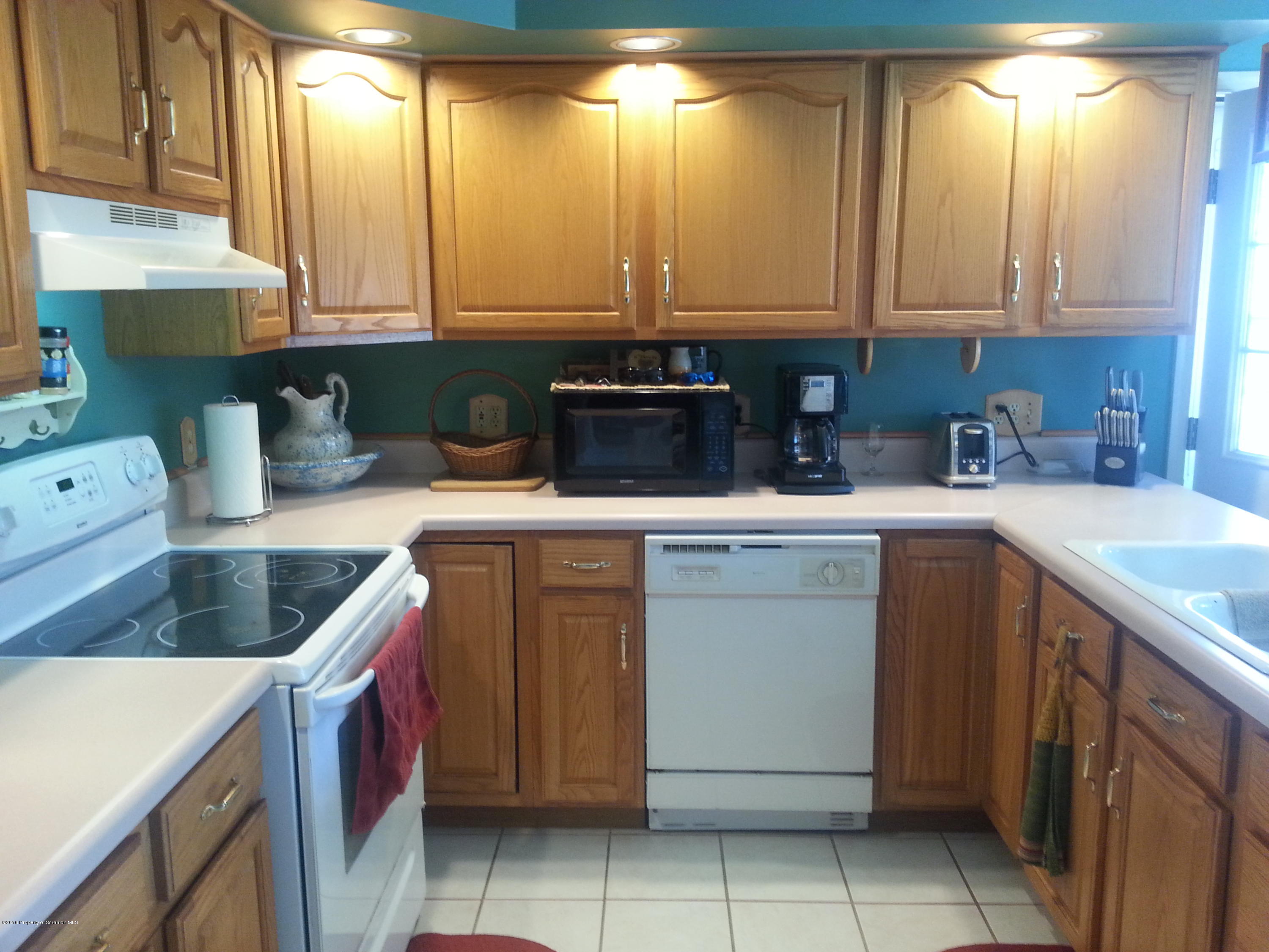 9021 State Rte 6 Meshoppen, PA 18630 - Photo 3 of 16 a kitchen with a sink and cabinets