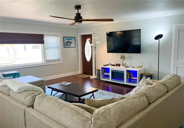 a living room with furniture and a flat screen tv