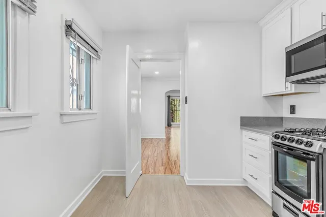 a kitchen with a stove and a microwave