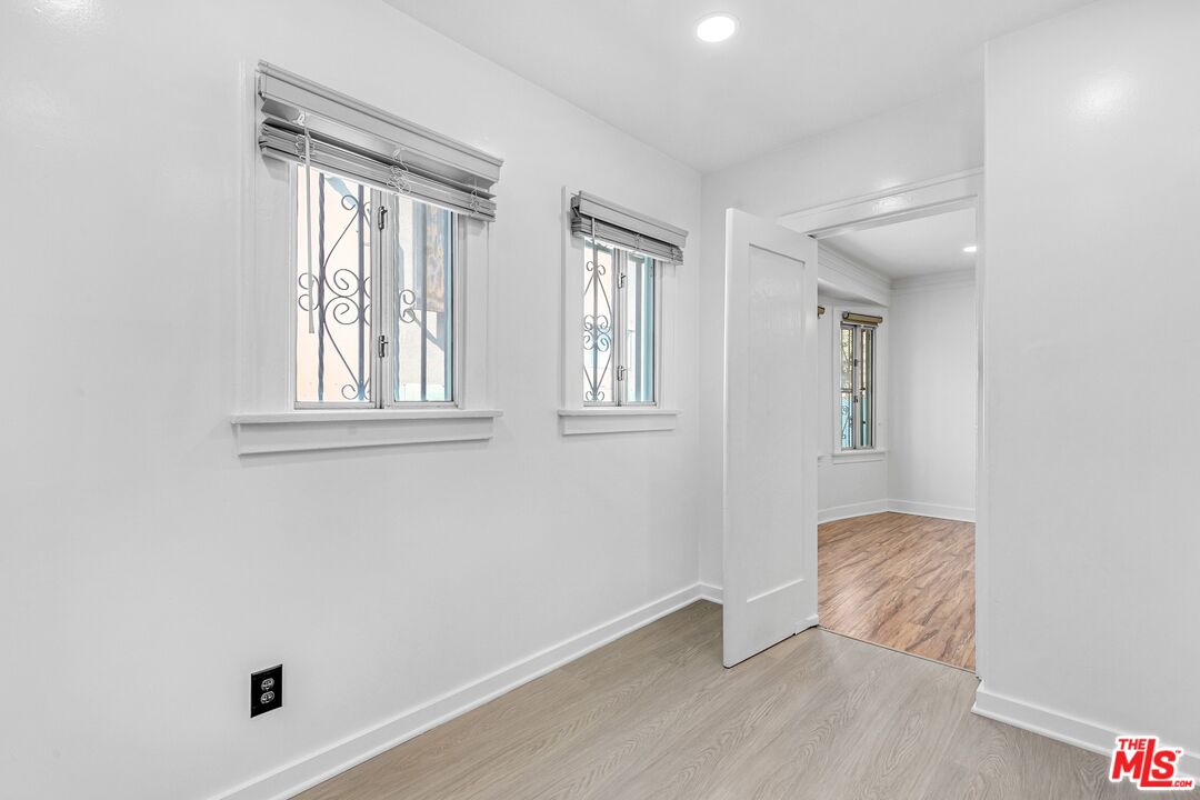 123 North Reno Street Los Angeles, CA 90026 - Photo 14 of 28 an empty room with windows and closet