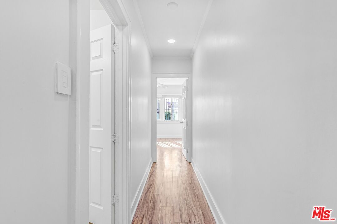 123 North Reno Street Los Angeles, CA 90026 - Photo 15 of 28 a view of a hallway with wooden floor