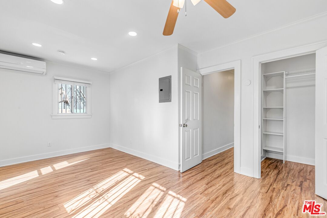 123 North Reno Street Los Angeles, CA 90026 - Photo 18 of 28 a view of empty room with wooden floor