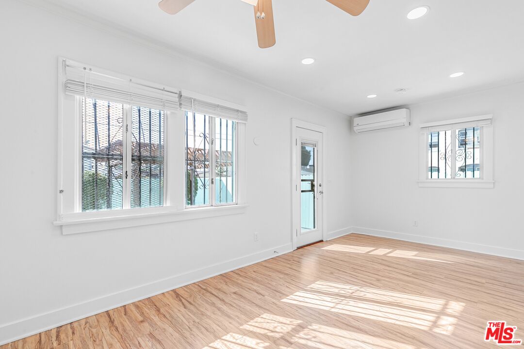 123 North Reno Street Los Angeles, CA 90026 - Photo 20 of 28 a view of a livingroom with wooden floor and a window