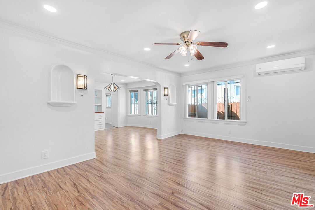 123 North Reno Street Los Angeles, CA 90026 - Photo 2 of 28 a view of an empty room with window and wooden floor