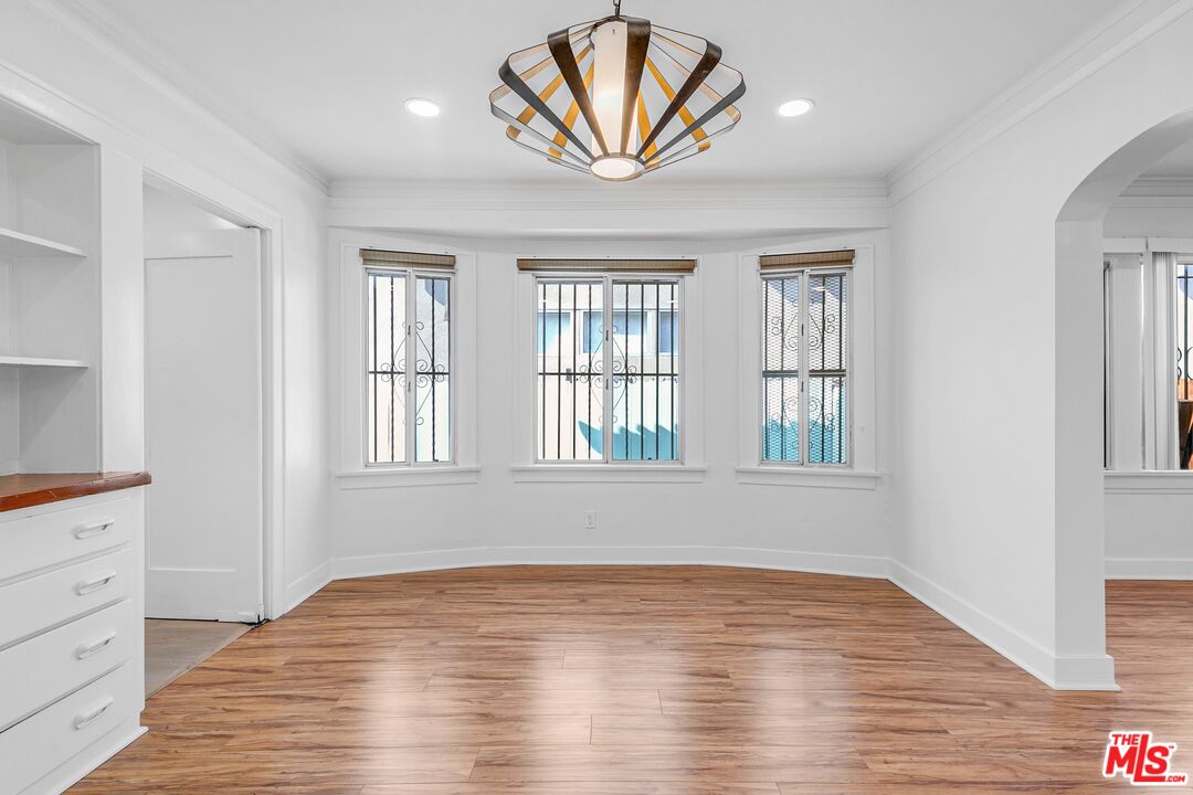 123 North Reno Street Los Angeles, CA 90026 - Photo 7 of 28 a view of empty room with window and wooden floor