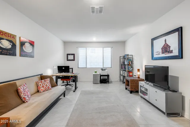 a view of a livingroom with furniture and a chandelier