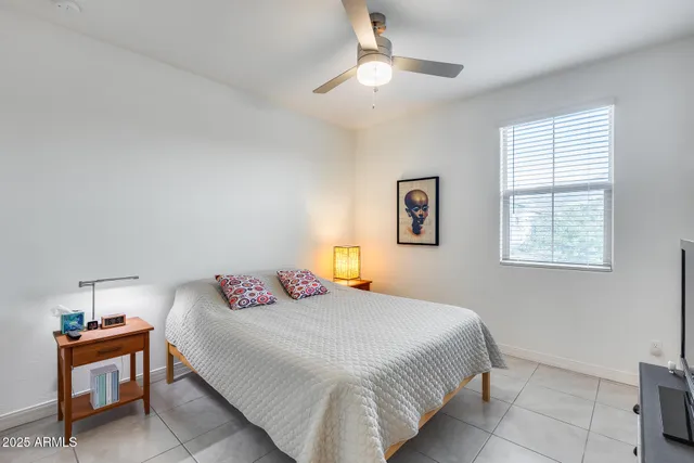 a bathroom with a double vanity sink toilet and a mirror