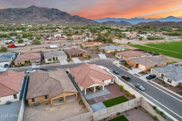 an aerial view of residential houses with outdoor space