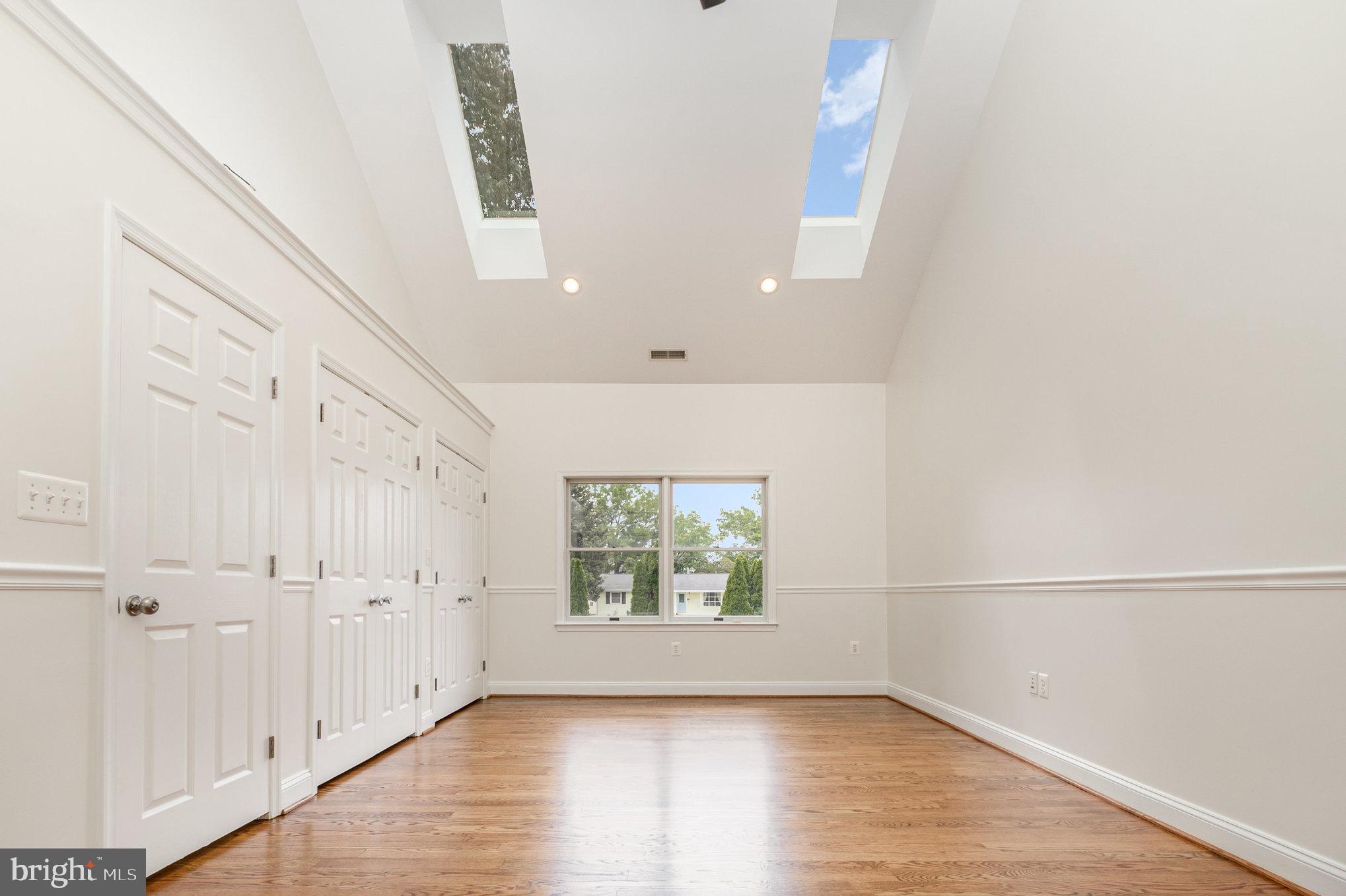 70 Johnson Road Pasadena, MD 21122 - Photo 17 of 35 an empty room with wooden floor and windows