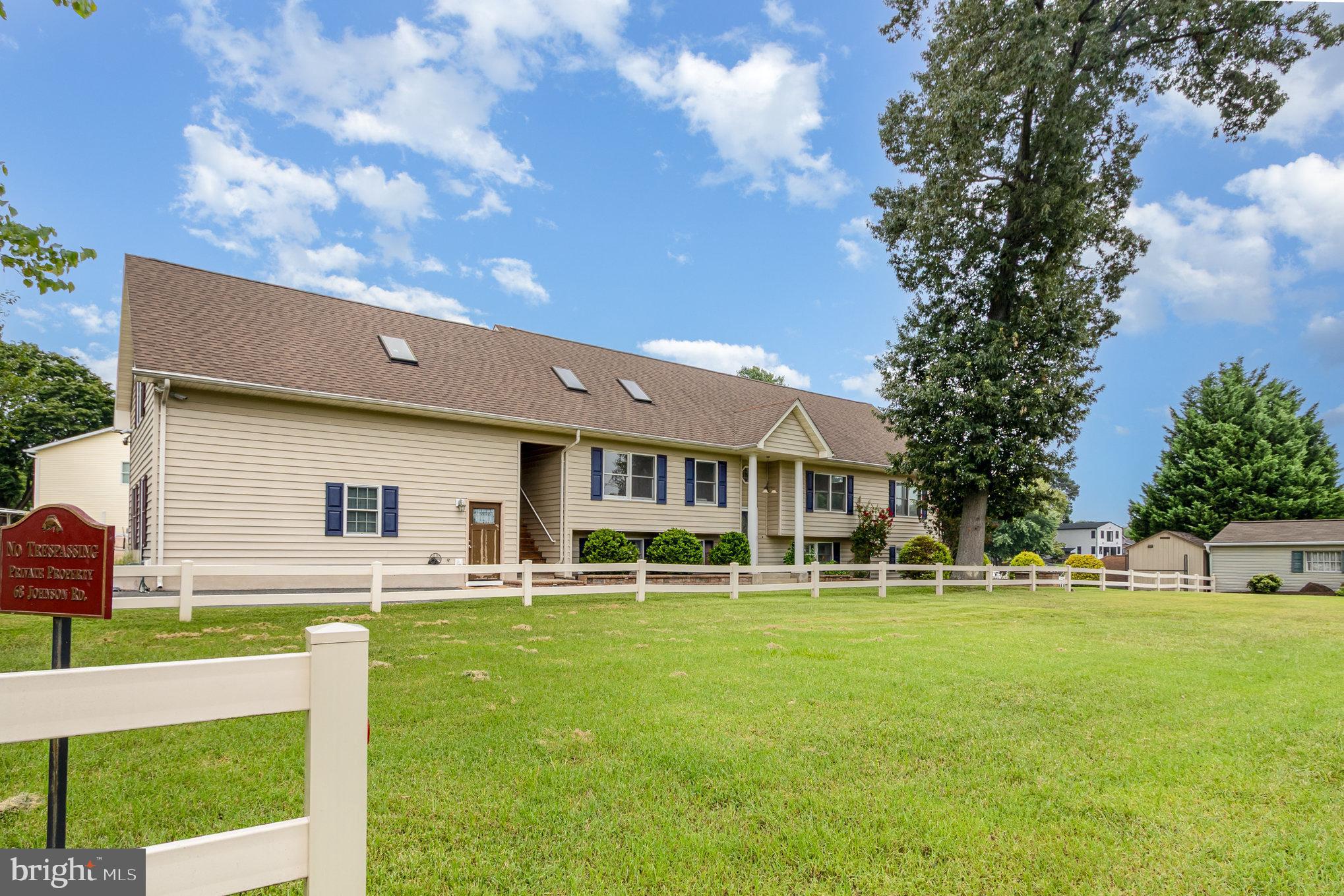 70 Johnson Road Pasadena, MD 21122 - Photo 2 of 35 a front view of house with a garden