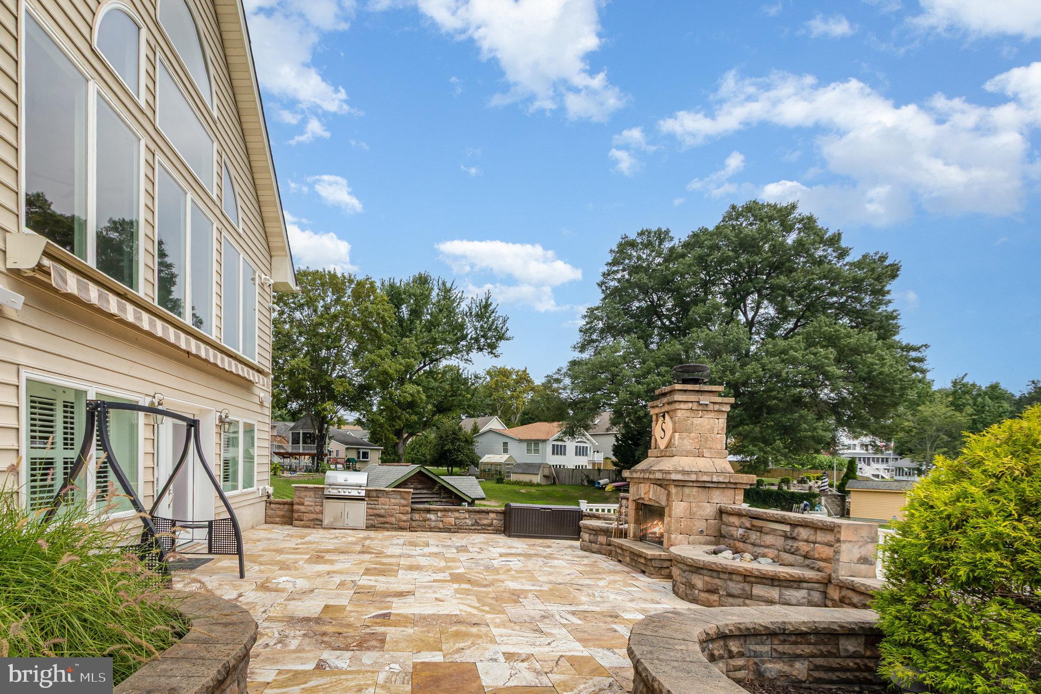70 Johnson Road Pasadena, MD 21122 - Photo 24 of 35 a view of a patio with table and chairs and potted plants
