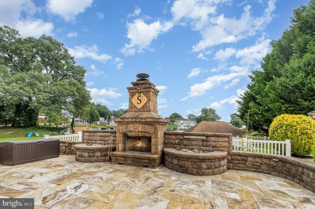 a view of a fireplace and table in the patio