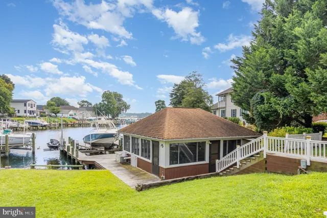 a view of a house with pool and porch