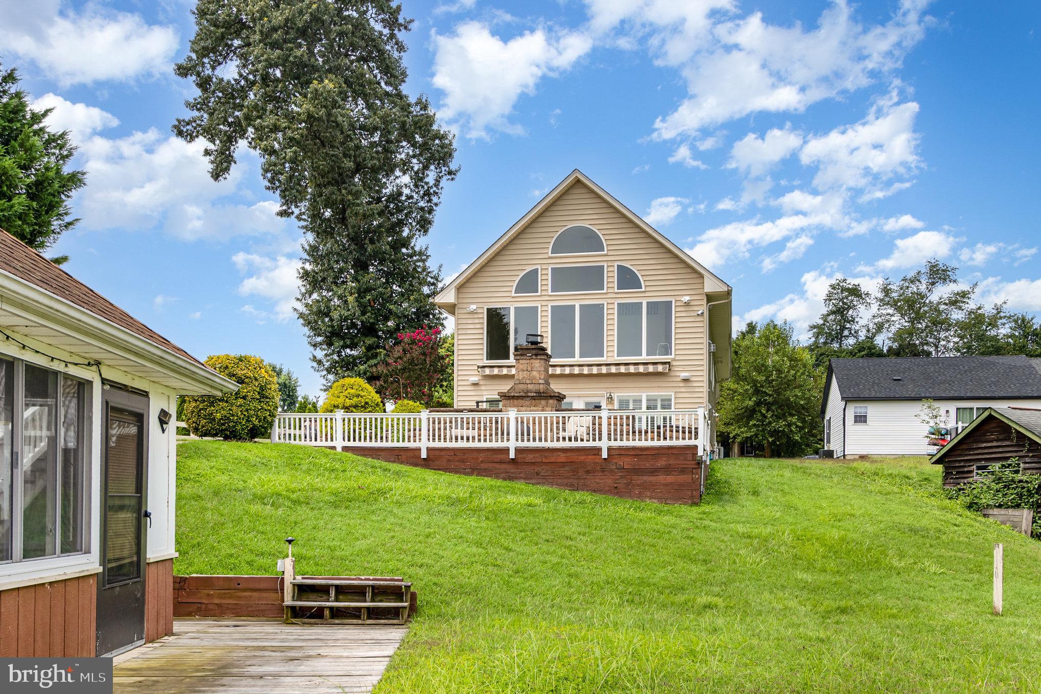 70 Johnson Road Pasadena, MD 21122 - Photo 31 of 35 a view of a house with a yard porch and sitting area