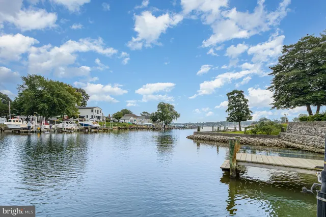 a view of a lake with boats and trees