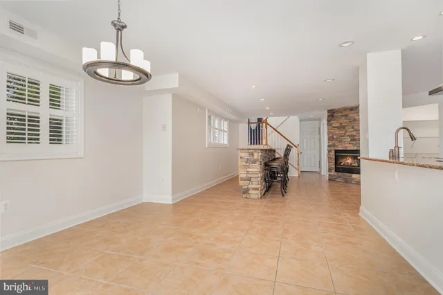 a view of a livingroom with furniture and a window