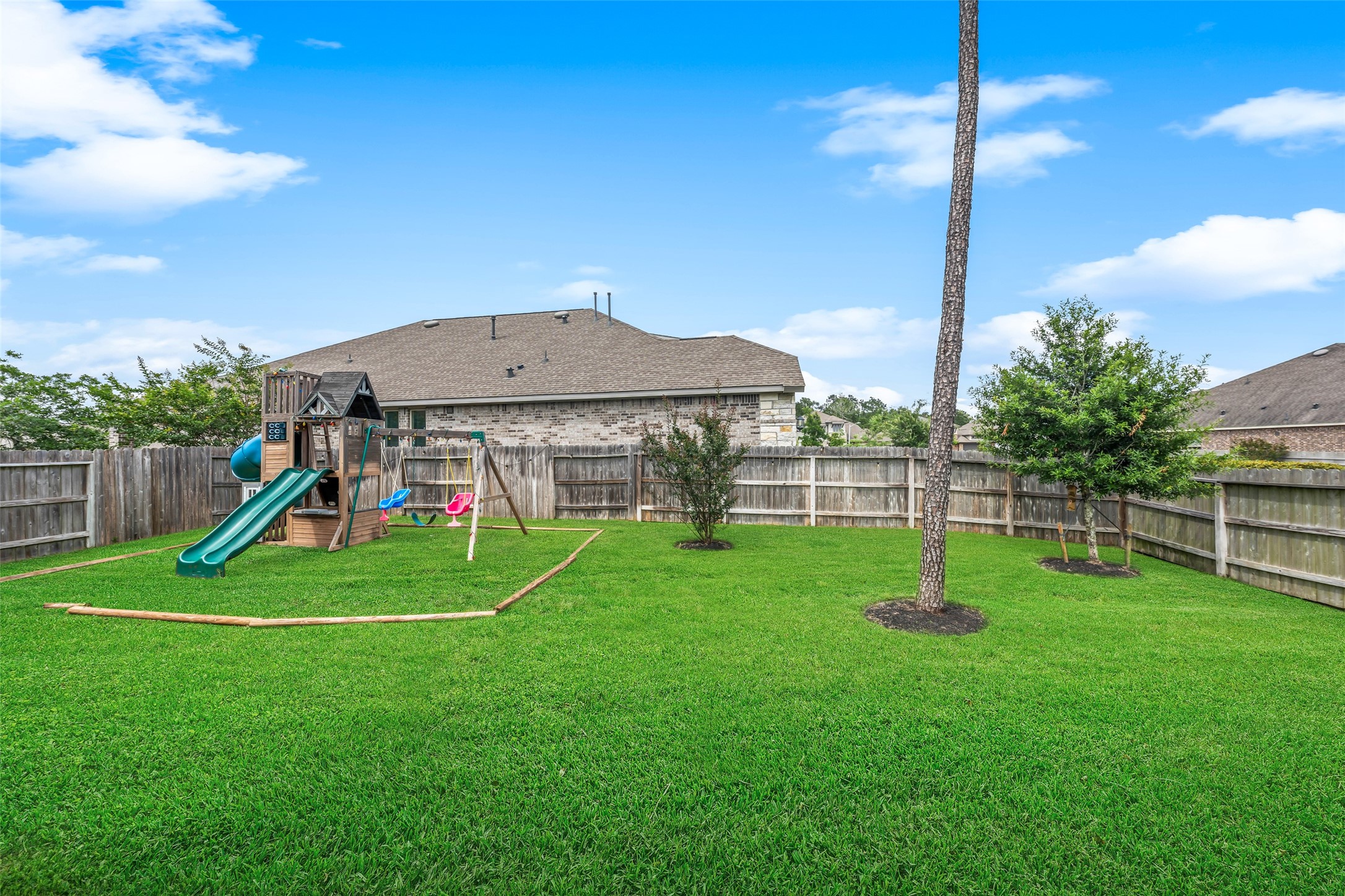 17323 Grand Canyon Road Conroe, TX 77302 - Photo 30 of 33 A sodded and quite private back yard for your pleasure.