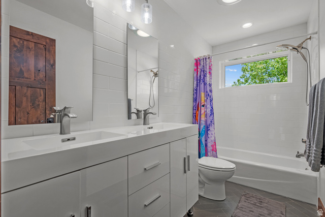 4221 Juniper Circle Alpine, UT 84004 - Photo 20 of 66 Dual vanity with integrated sinks, brushed nickel faucets, and a white subway tile backsplash