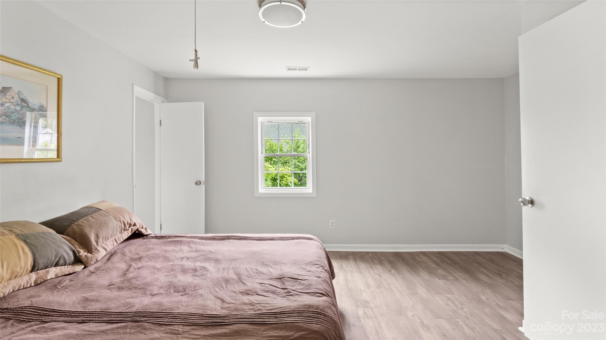 705 Sumter Street Lancaster, SC 29720 - Photo 11 of 16 a bedroom with a bed and a window
