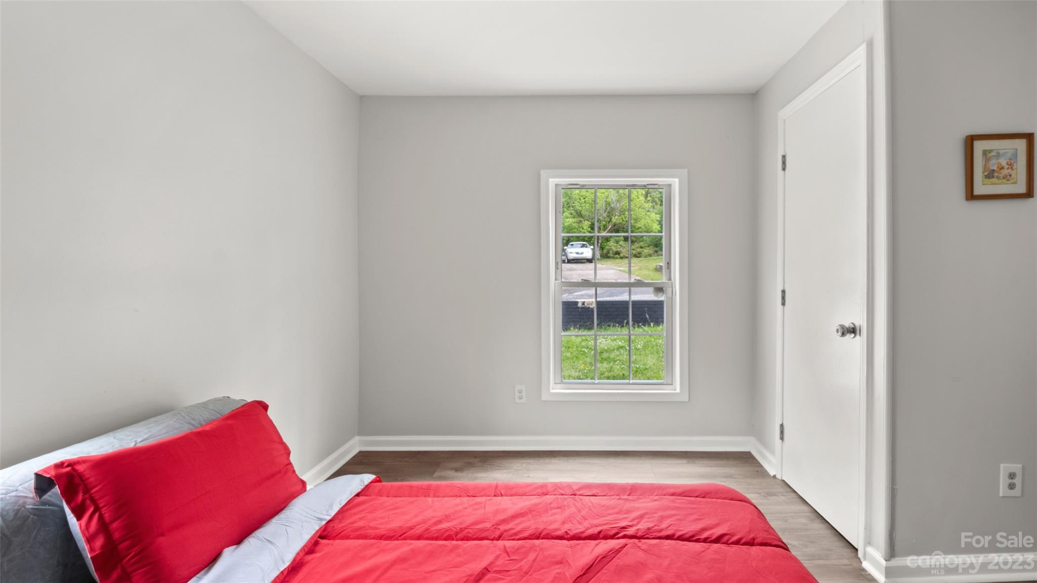 705 Sumter Street Lancaster, SC 29720 - Photo 12 of 16 a bedroom with a bed and a window