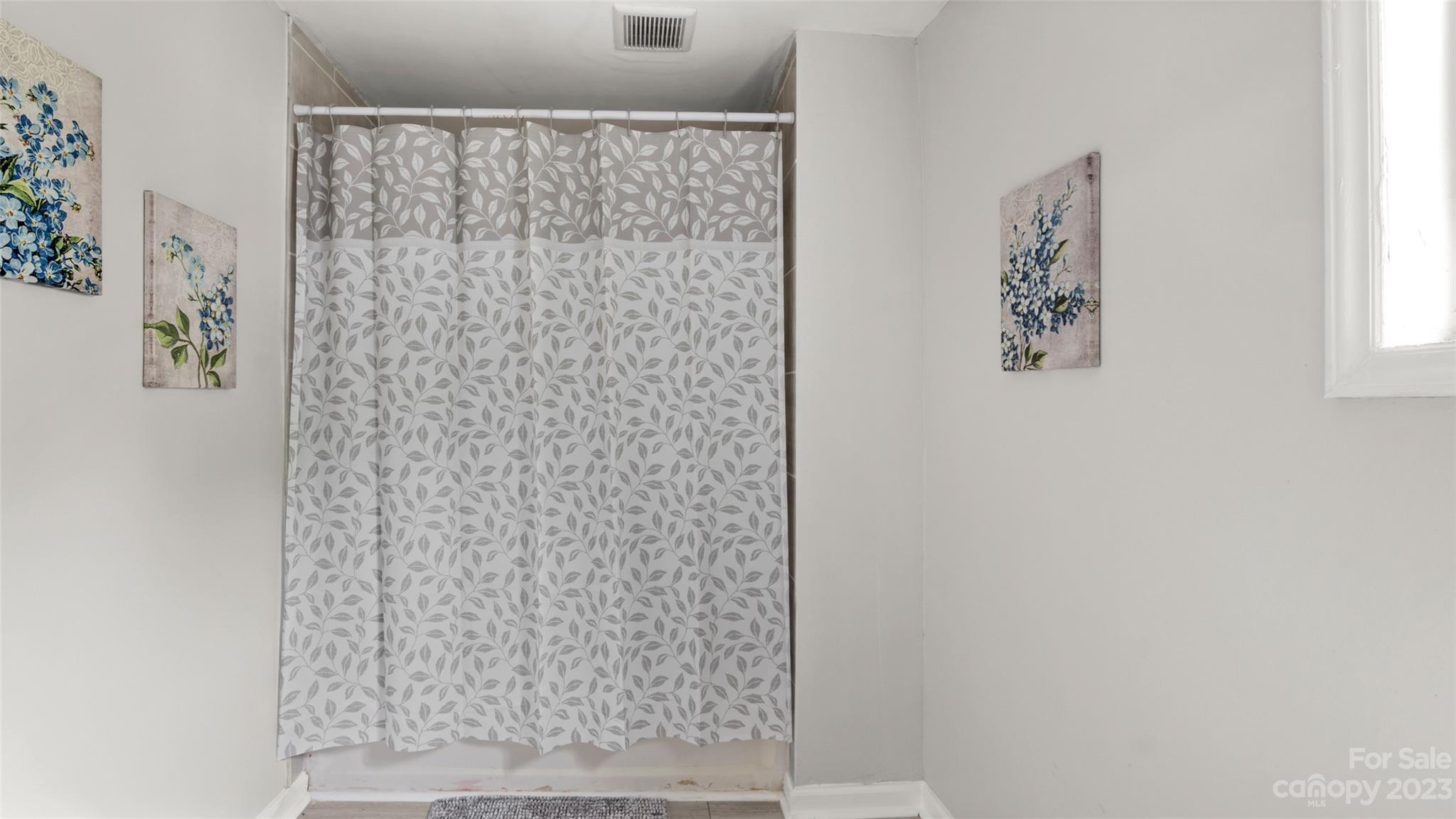 705 Sumter Street Lancaster, SC 29720 - Photo 8 of 16 a bathroom with a shower curtain