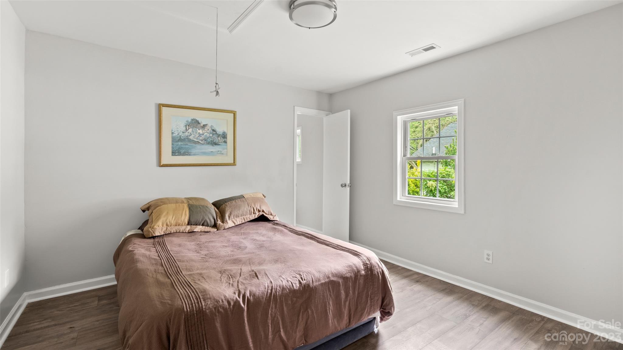 705 Sumter Street Lancaster, SC 29720 - Photo 10 of 16 a bedroom with a bed and a window