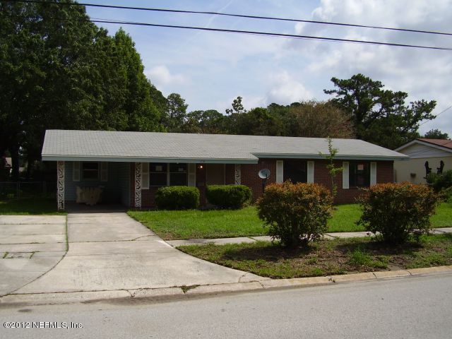 5721 Beney Road Jacksonville, FL 32207 - Photo 1 of 11 a front view of a house with a garden and plants