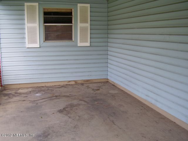 5721 Beney Road Jacksonville, FL 32207 - Photo 11 of 11 a view of a backyard space with a garage