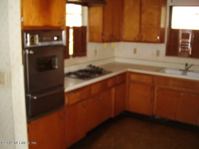 5721 Beney Road Jacksonville, FL 32207 - Photo 3 of 11 a kitchen with a sink and cabinets