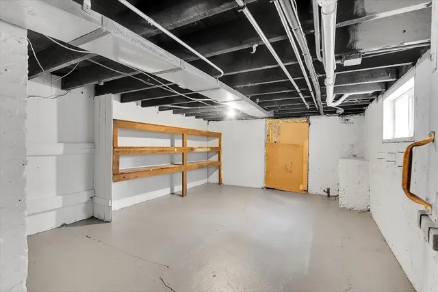 a view of an empty room with a garage