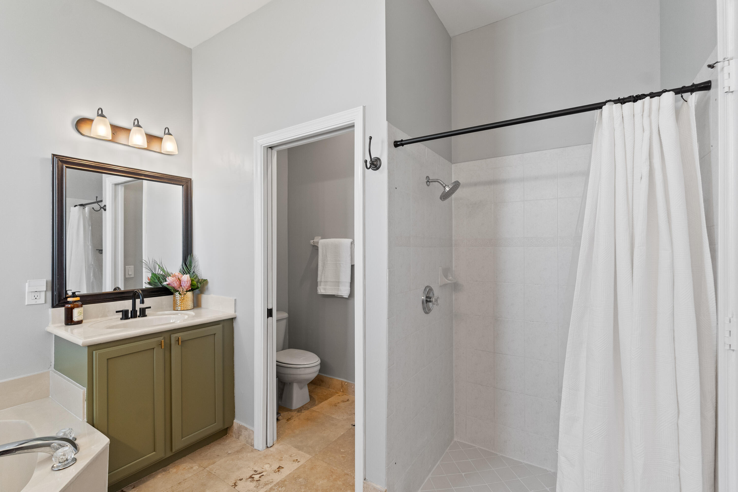 13461 Southwest 29th Street Miramar, FL 33027 - Photo 12 of 54 a bathroom with a sink toilet and shower