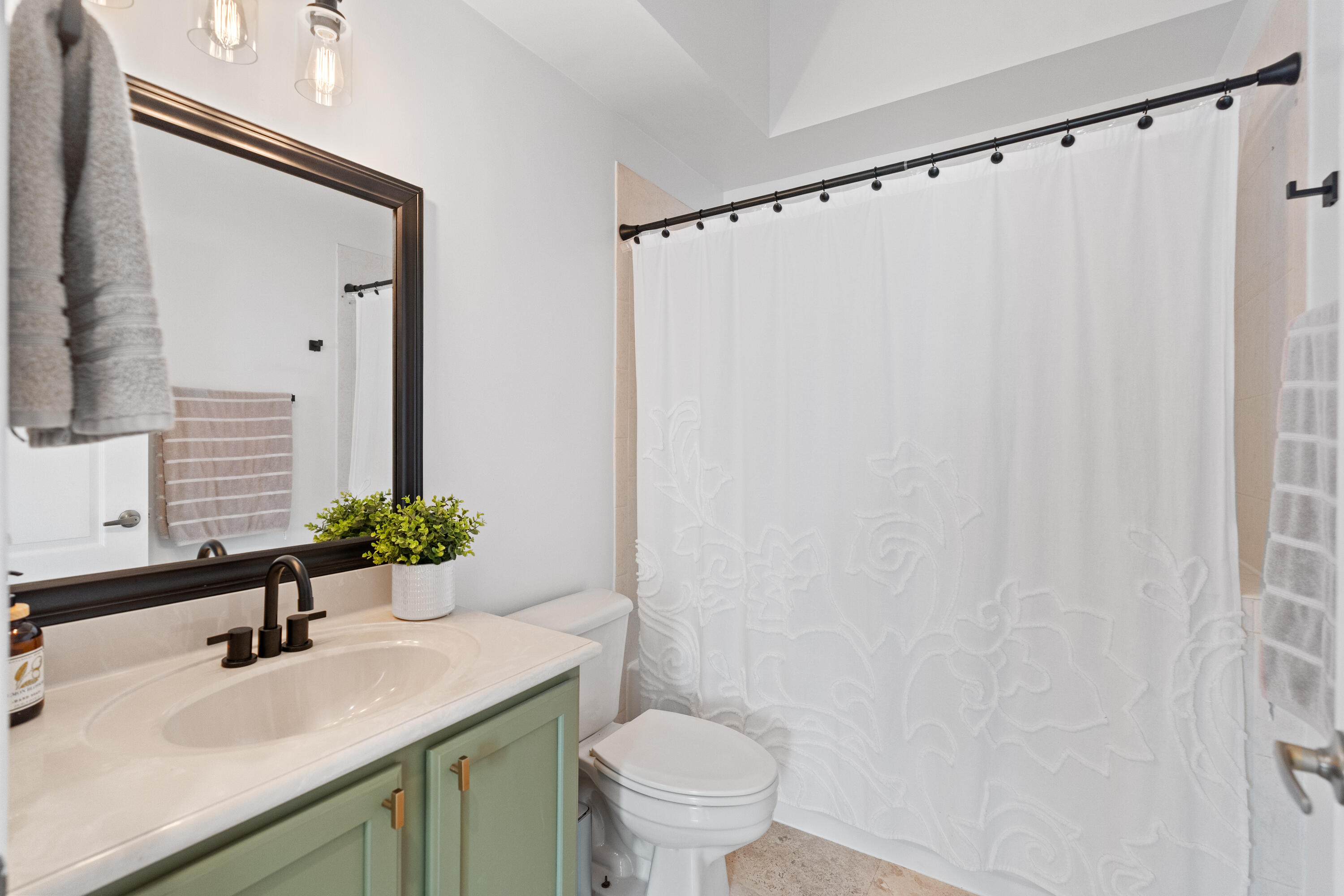 13461 Southwest 29th Street Miramar, FL 33027 - Photo 15 of 54 a bathroom with a sink toilet and shower