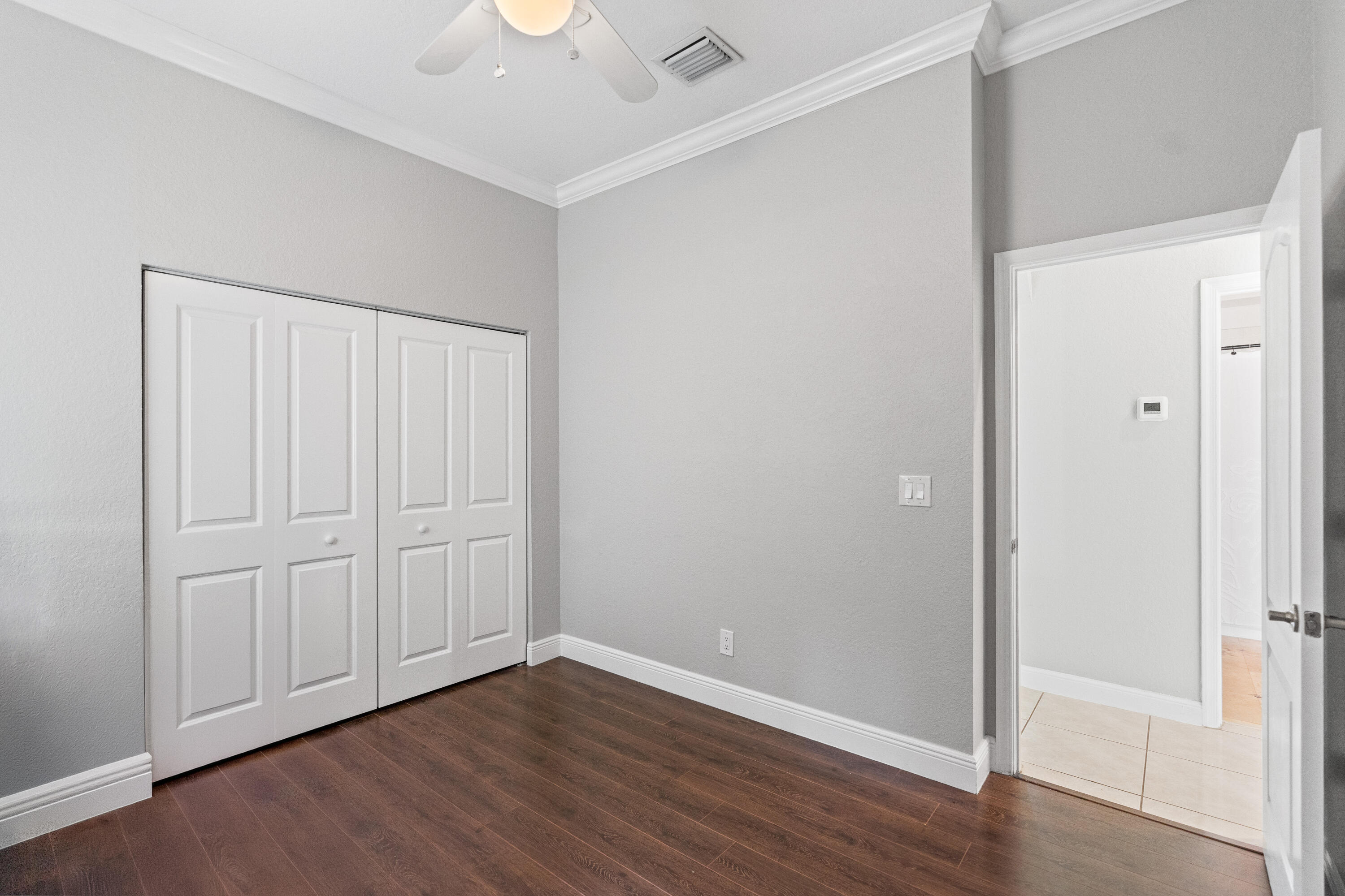 13461 Southwest 29th Street Miramar, FL 33027 - Photo 19 of 54 a view of an empty room with wooden floor