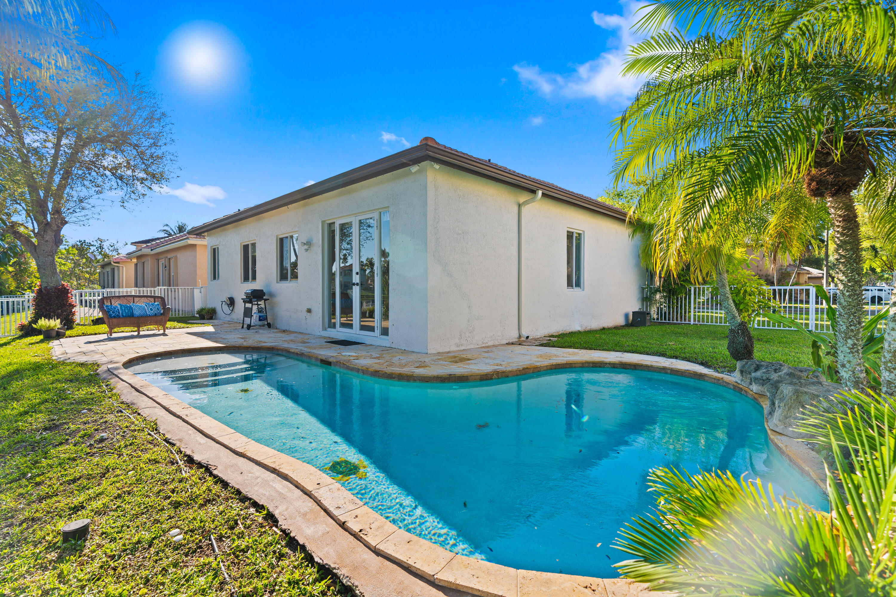 13461 Southwest 29th Street Miramar, FL 33027 - Photo 2 of 54 a view of swimming pool with outdoor seating