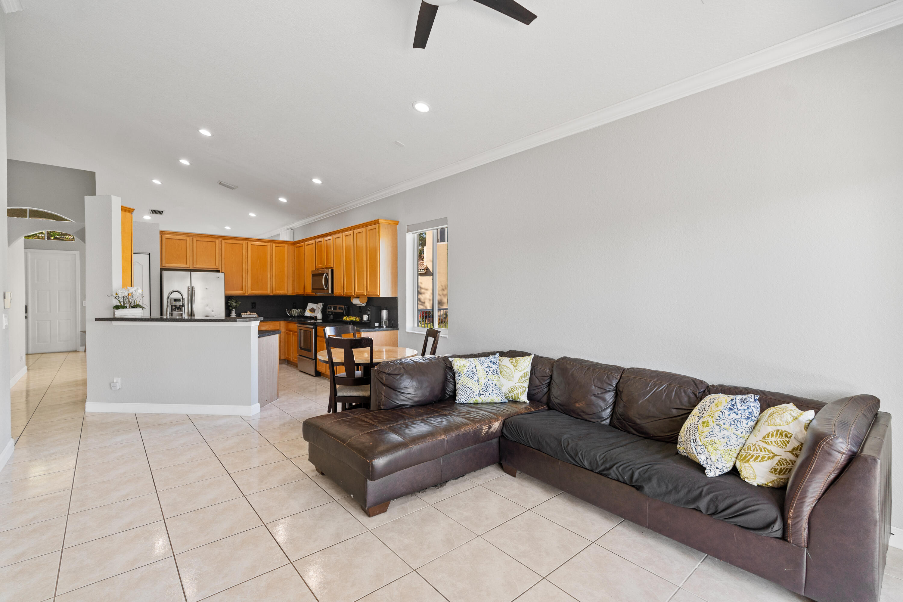 13461 Southwest 29th Street Miramar, FL 33027 - Photo 26 of 54 a living room with furniture and kitchen view