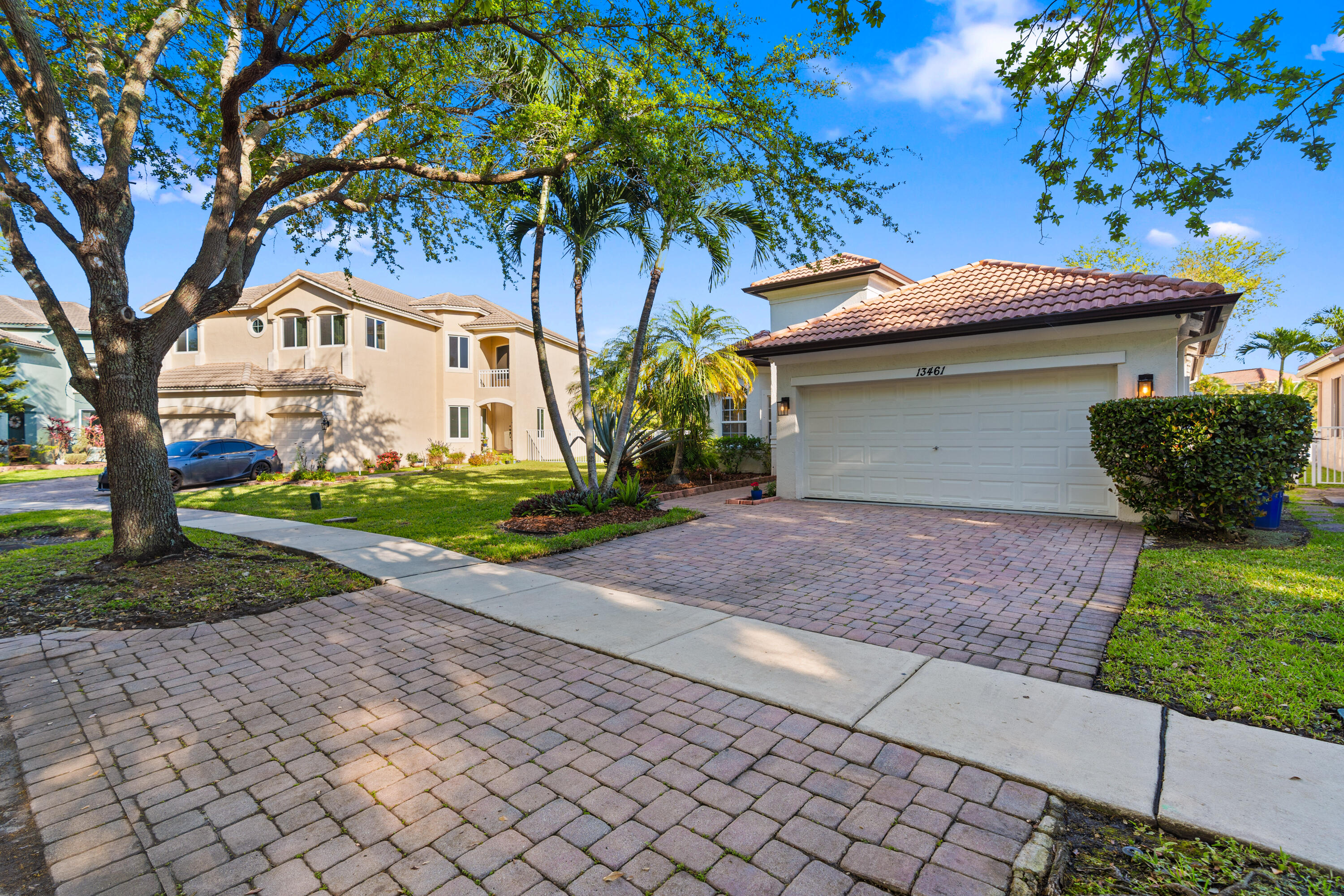 13461 Southwest 29th Street Miramar, FL 33027 - Photo 36 of 54 a front view of a house with garden