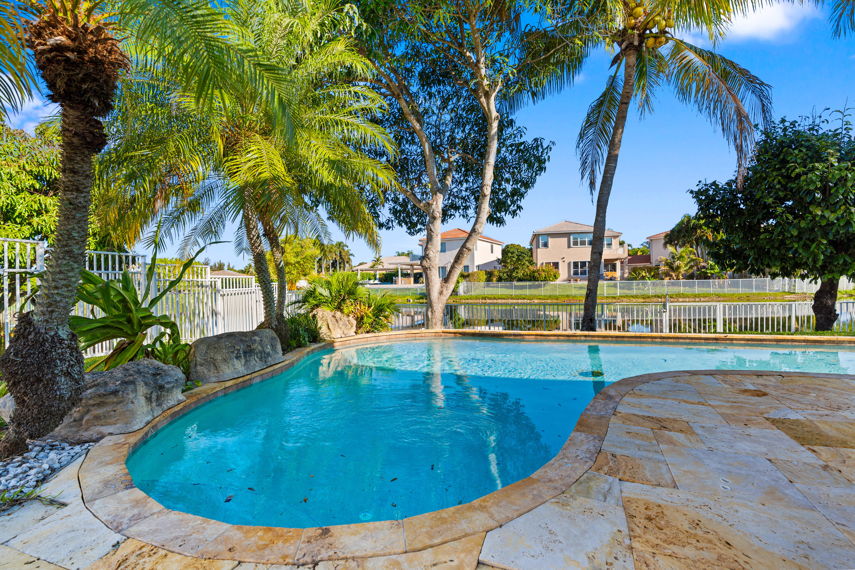 13461 Southwest 29th Street Miramar, FL 33027 - Photo 4 of 54 a view of a swimming pool with a yard