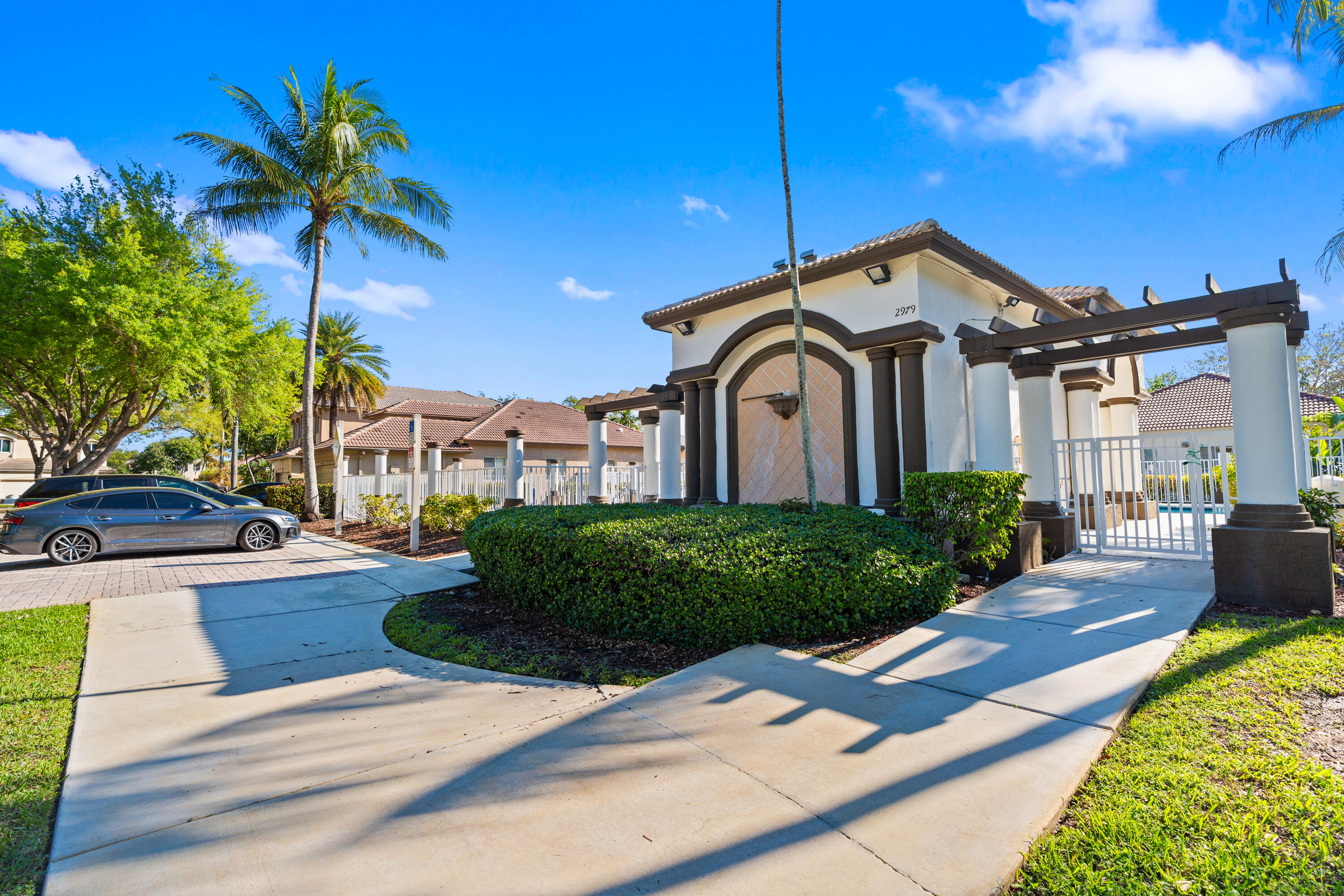 13461 Southwest 29th Street Miramar, FL 33027 - Photo 44 of 54 a front view of a house with garden