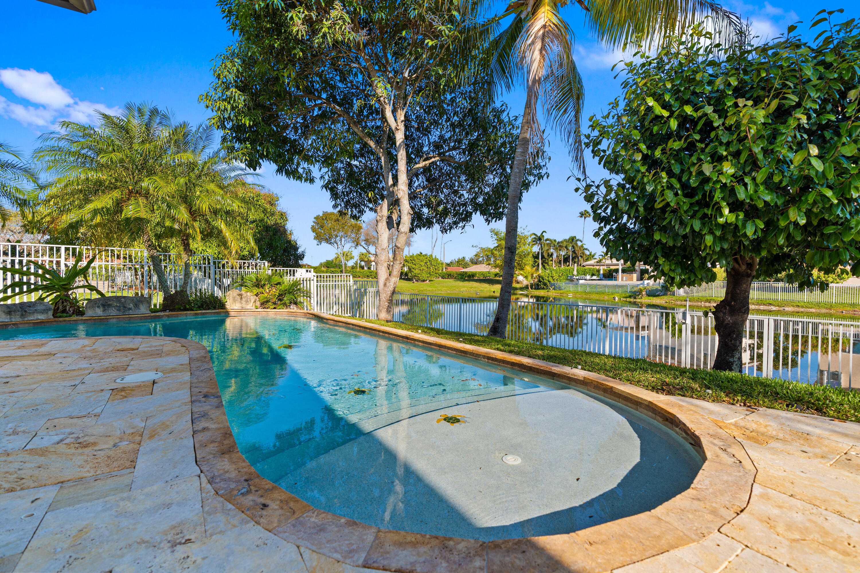 13461 Southwest 29th Street Miramar, FL 33027 - Photo 5 of 54 a view of a swimming pool with a lounge chairs
