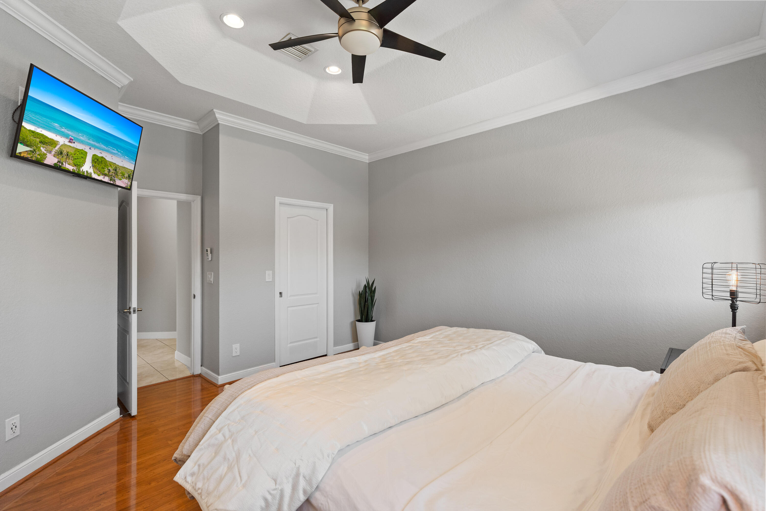 13461 Southwest 29th Street Miramar, FL 33027 - Photo 10 of 54 a bedroom with a bed and a chandelier