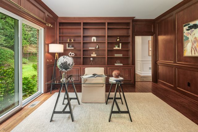 a workspace with furniture and window