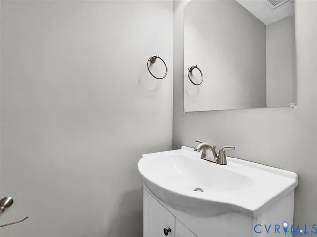 a bathroom with a sink and mirror