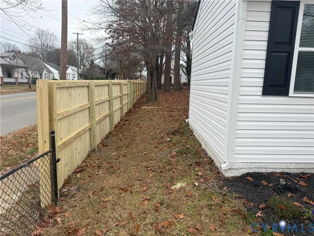 a view of a pathway of a house with backyard