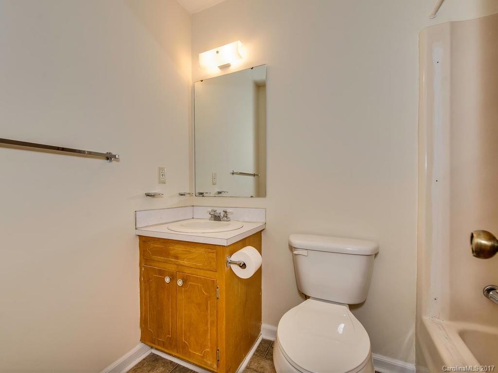 5117 Austin Road Monroe, NC 28112 - Photo 11 of 19 a bathroom with a toilet sink and mirror