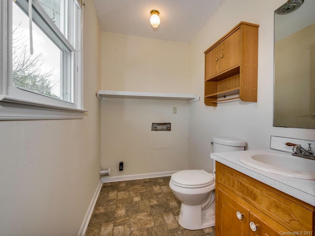5117 Austin Road Monroe, NC 28112 - Photo 14 of 19 a bathroom with a granite countertop toilet and a sink