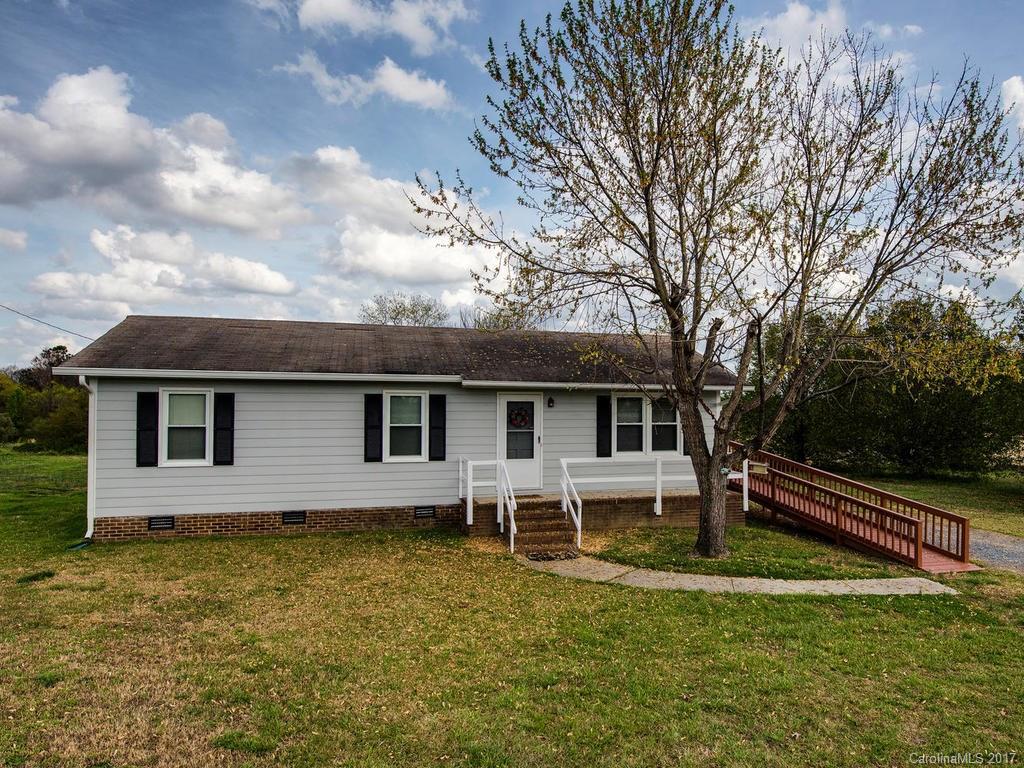 5117 Austin Road Monroe, NC 28112 - Photo 19 of 19 a white house that has a tree in it