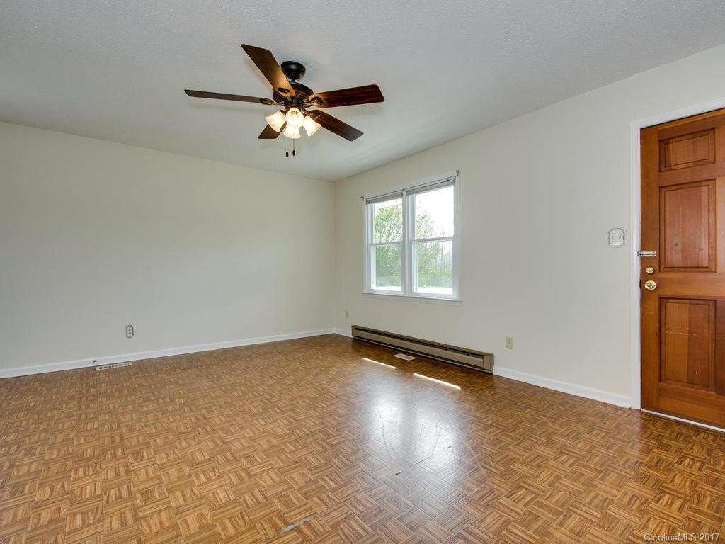 5117 Austin Road Monroe, NC 28112 - Photo 4 of 19 an empty room with windows and fan